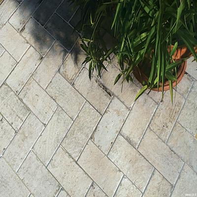 White herrigbone brick tiles